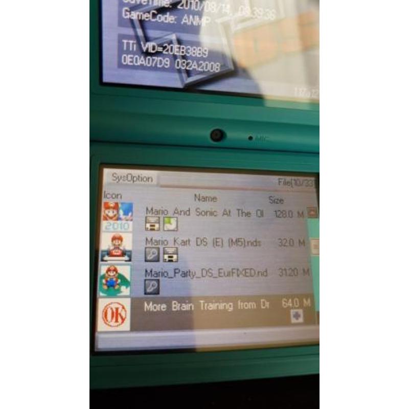 Dsi in doos vol met spellen erop mario pokemon ect